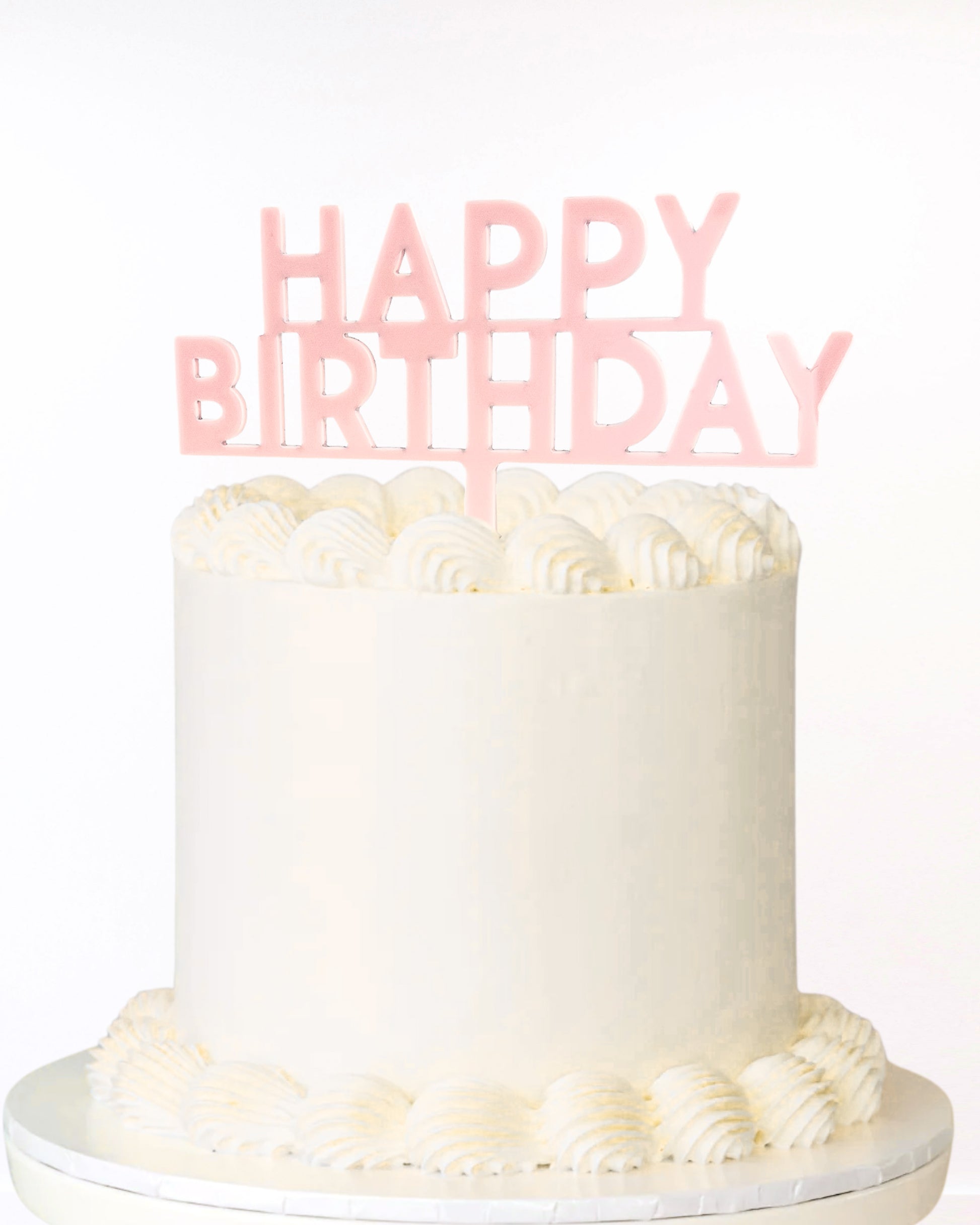 Blush pink acrylic happy birthday cake topper on cake 