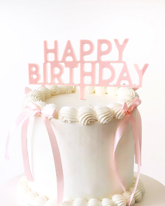 Blush pink acrylic happy birthday cake topper on cake 
